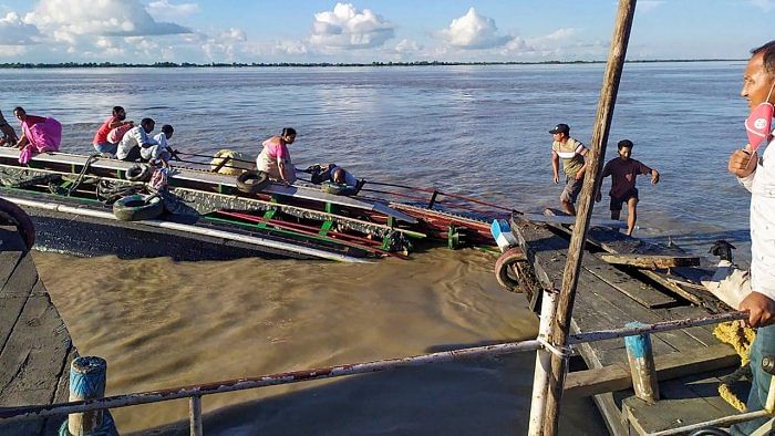 Rescue work underway after two boats capsized near Neemati Ghat following a head-on collision, in Jorhat. Credit: PTI Photo