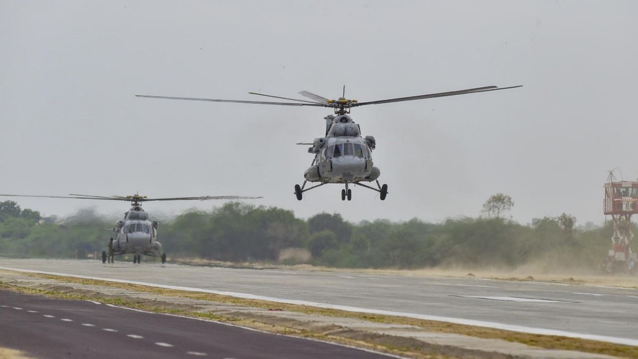 Indian Air Force Mi 17 helicopters take off as part of rehearsals before inauguration of an emergency landing strip at Gandhav Bhakasar section on NH-925 in Barmer district, Thursday, Sept. 9, 2021. Credit: PTI Photo