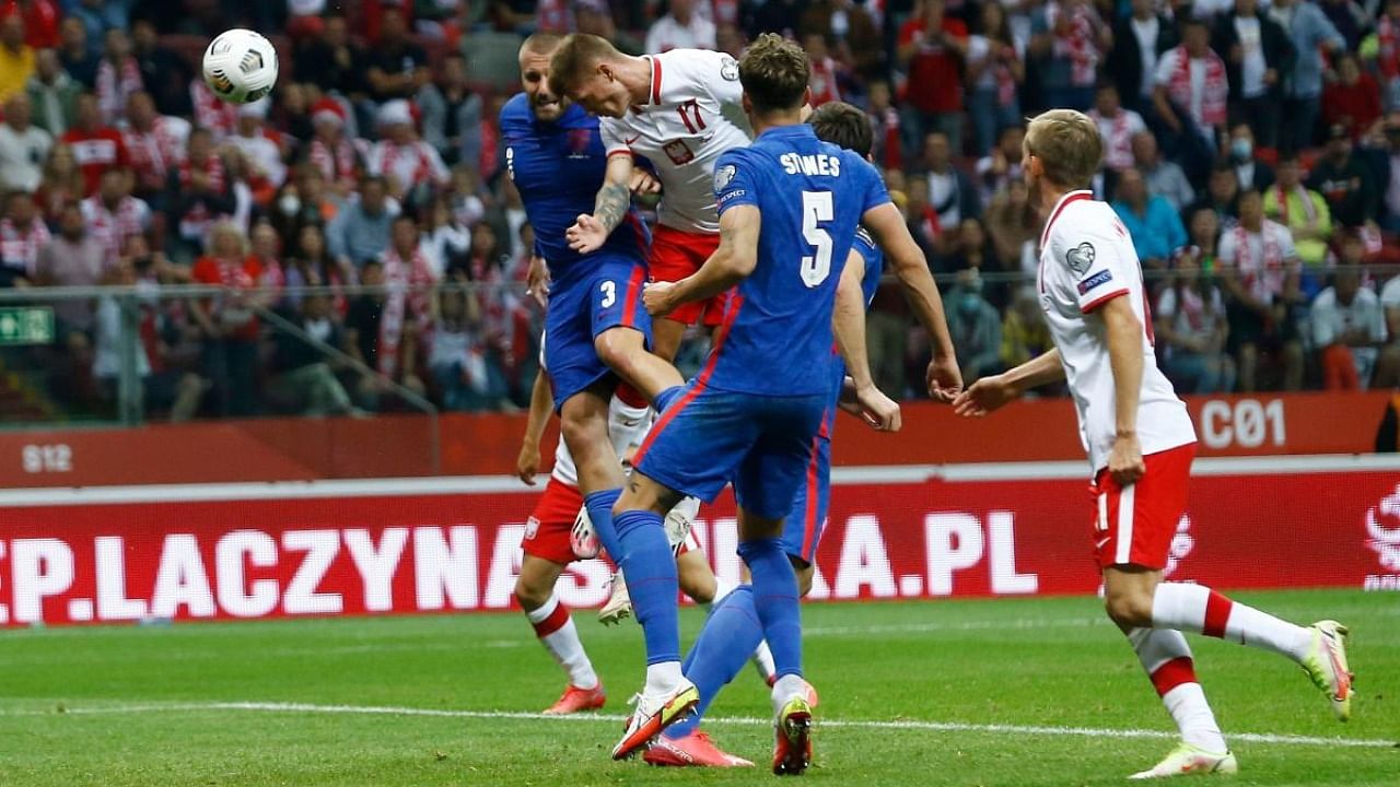 Poland's Damian Szymanski scores their first goal. Credit: Reuters Photo