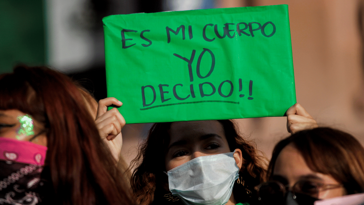 A woman holds up a banner which reads "My body, I decide" at a protest rally in Mexico. Credit: Reuters Photo