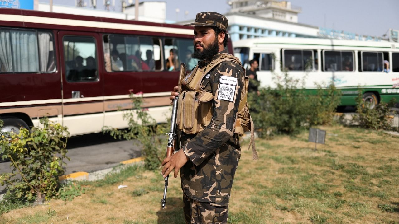 A member of Taliban security forces stands guard at the international airport in Kabul. Credit: Reuters Photo