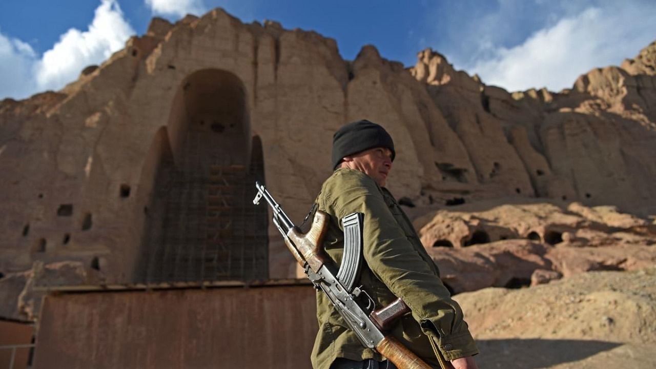 A policeman patrols the site where the statues of Buddha stood in Bamiyan before being destroyed by the Taliban in March 2001. Credit: AFP File Photo