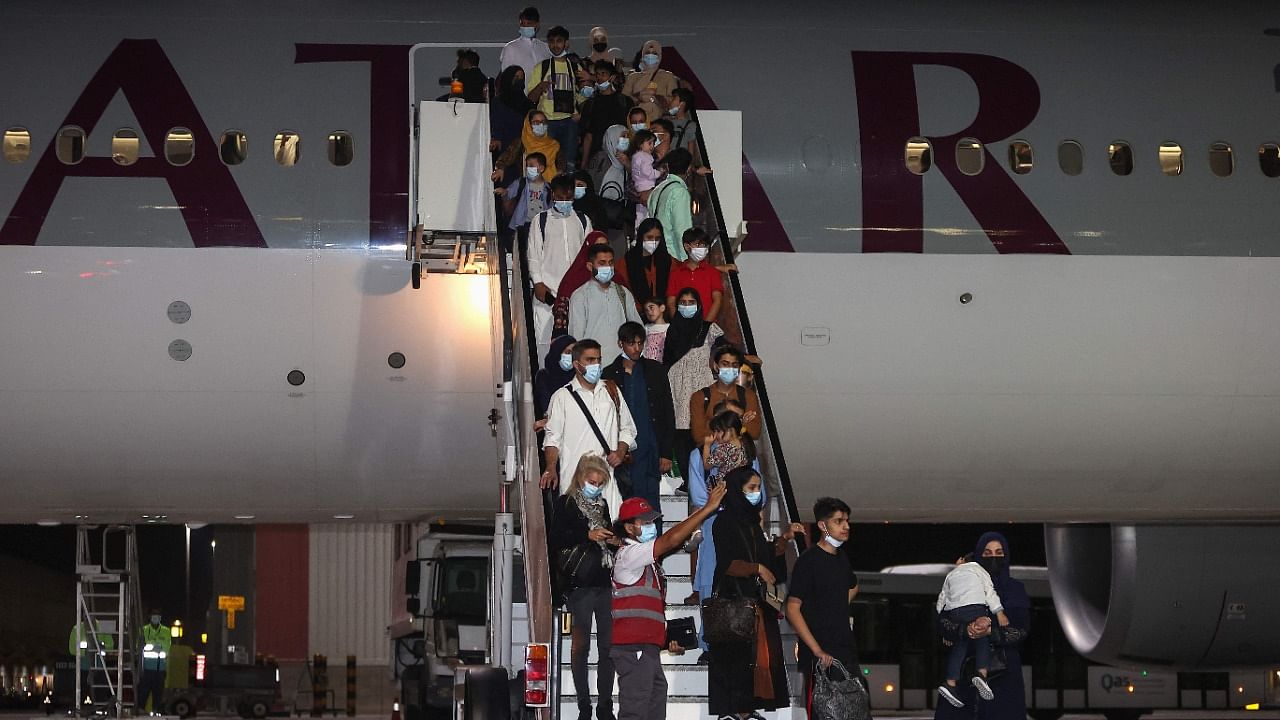 Evacuees from Afghanistan arrive at Hamad International Airport in Doha. Credit: AFP Photo