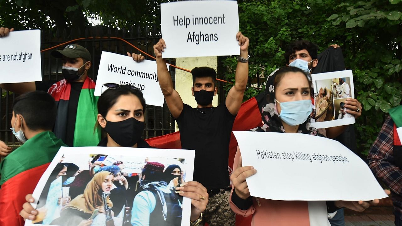 Afghan refugees stage a protest against the Taliban takeover of Afghanistan, in New Delhi, Friday. Credit: PTI Photo