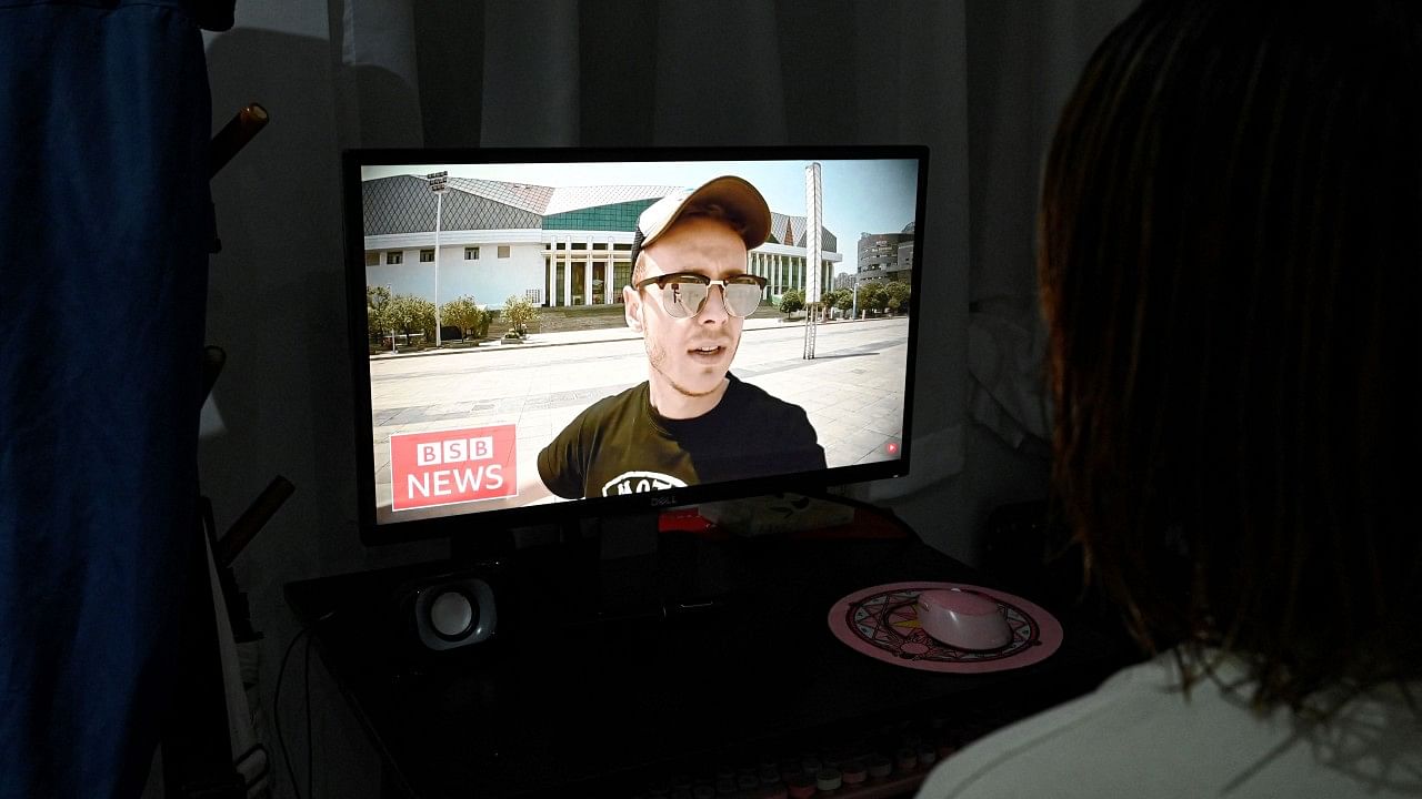 Jason Lightfoot speaks on his YouTube channel as seen on a computer screen in Beijing. Credit: AFP Photo