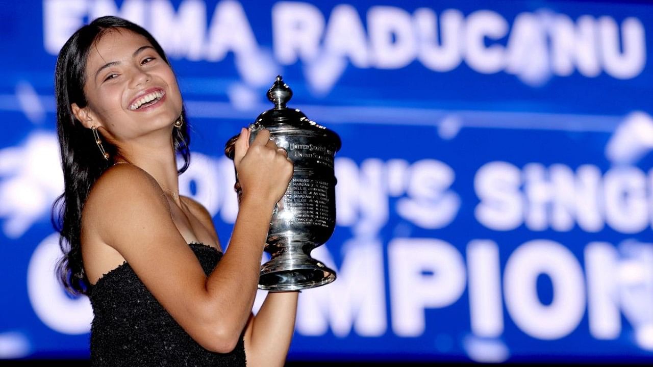 Emma Raducanu of Great Britain poses with the championship trophy after defeating Leylah Annie Fernandez of Canada. Credit: AFP Photo