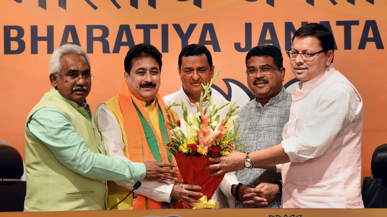Congress MLA from Purola (Uttarakhand), Rajkumar joins Bharatiya Janata Party (BJP) in the presence of Union Minister Dharmendra Pradhan and Uttarakhand CM Pushkar Singh Dhami, in New Delhi. Credit: PTI Photo