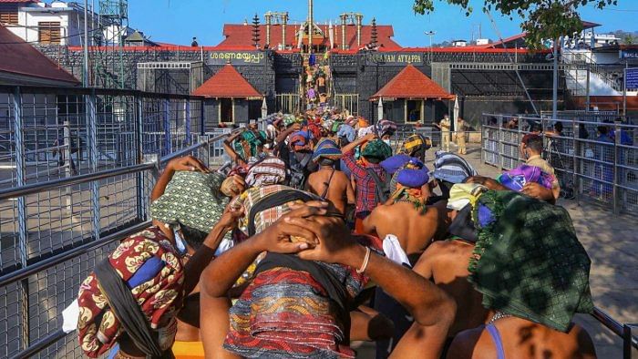 Devotees arrive to attend 'Mandala Puja', at Sabarimala Temple in Pathanamthitta district. Credit: PTI File Photo