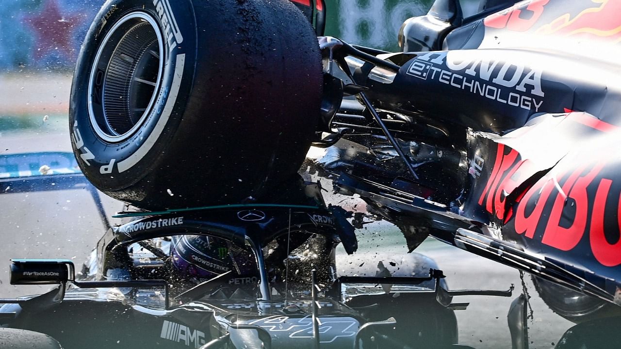 The Briton said the inside of a rear tyre had hit his helmet. Credit: AFP Photo