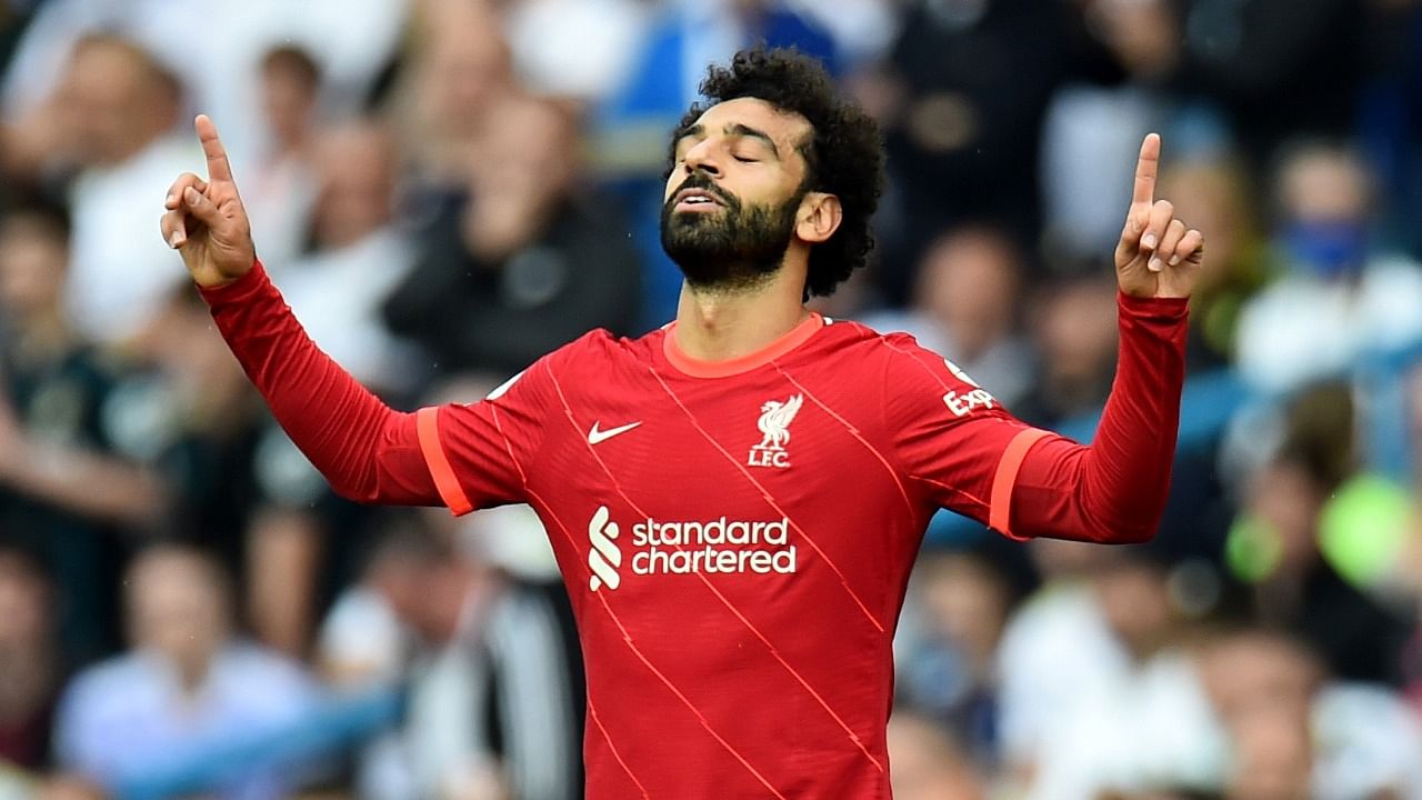 Liverpool's Mohamed Salah celebrates scoring his 100th Premier League goal during a 3-0 win over Leeds United. Credit: Reuters Photo