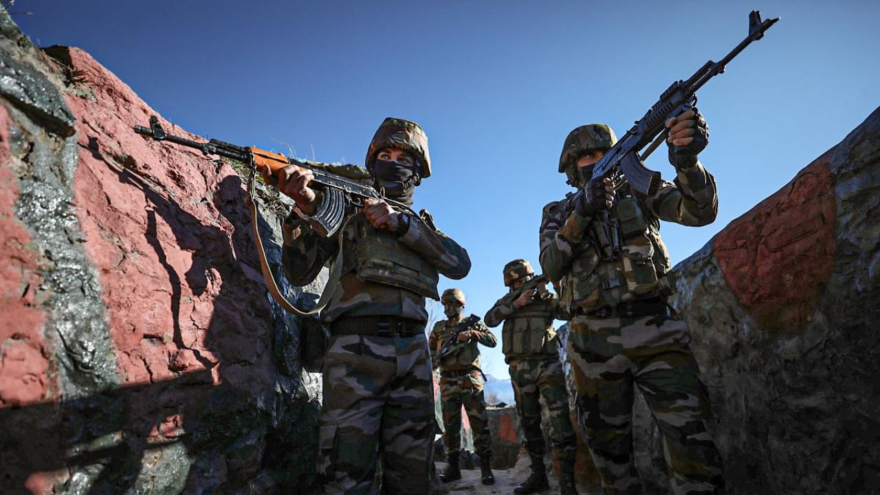Indian army troops patrol along the Line of Contrl in Rajouri district. Credit: PTI Photo