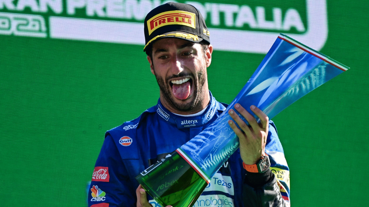 Daniel Ricciardo celebrates on the podium. Credit: AFP Photo