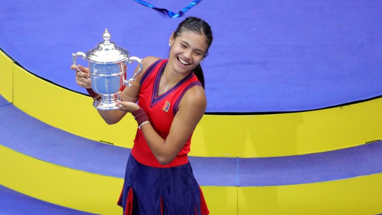 Britain's Emma Raducanu celebrates with the trophy after winning the 2021 US Open Tennis tournament women's final match against Canada's Leylah Fernandez at the USTA Billie Jean King National Tennis Center in New York. Credit: AFP Photo