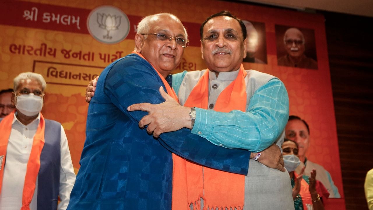 Senior BJP leader Bhupendra Patel (L), who will succeed Vijay Rupani (R) as the Chief Minister of Gujarat, after a meeting in Gandhinagar, Sunday. Credit: PTI Photo