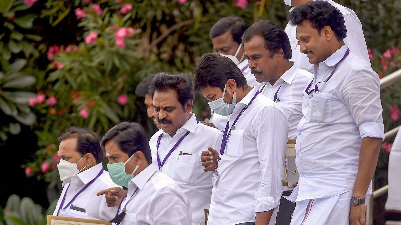 Tamil Nadu Chief Minister M K Stalin's son and DMK party's youth wing secretary Udayanidhi Stalin along with School Education Minister Anbil Mahesh Poyyamozhi and party MLAs, leaves after attending the last day of the State Budget Session, at Kalaivanar Arangam, in Chennai. Credit: PTI File Photo