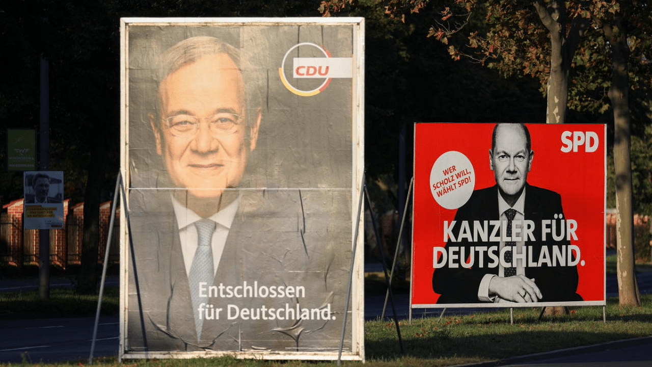 Election posters of Germany's top candidates for chancellor, North Rhine-Westphalia's State Premier and Christian Democratic Union (CDU) leader Armin Laschet and Olaf Scholz, German Minister of Finance of the Social Democratic Party (SPD) are pictured in Berlin. Credit: Reuters Photo