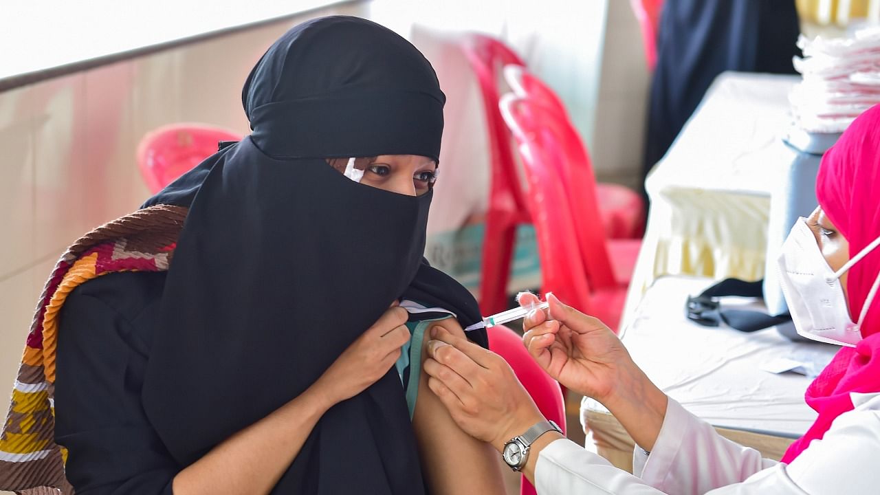 A beneficiary receives a dose of Covid-19 vaccine, at a special vaccination drive "Vaccination Mela", in Bengaluru. Credit: PTI File Photo