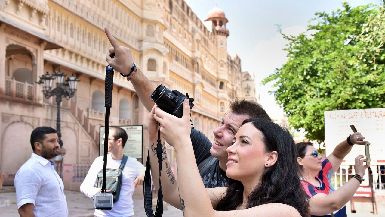 Tourists click photographs of Junagarh Fort. Credit: PTI Photo