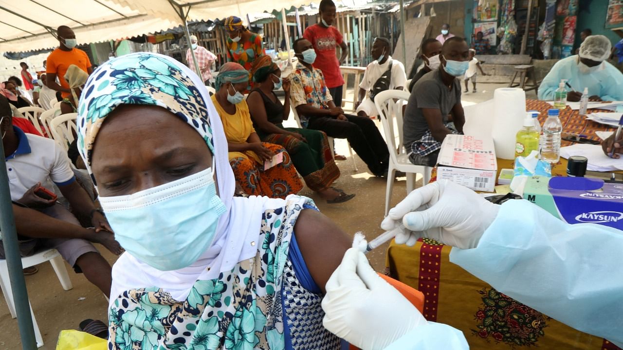 A resident receives a vaccine as vaccinations against Ebola continue in Alakro, where a case of Ebola was confirmed, in Abidjan, Ivory Coast. Credit: Reuters File Photo