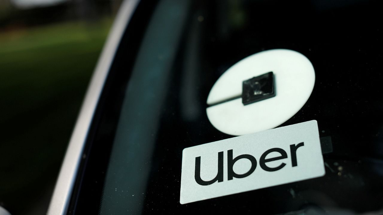<div class="paragraphs"><p>An Uber logo is shown on a rideshare vehicle. </p></div>