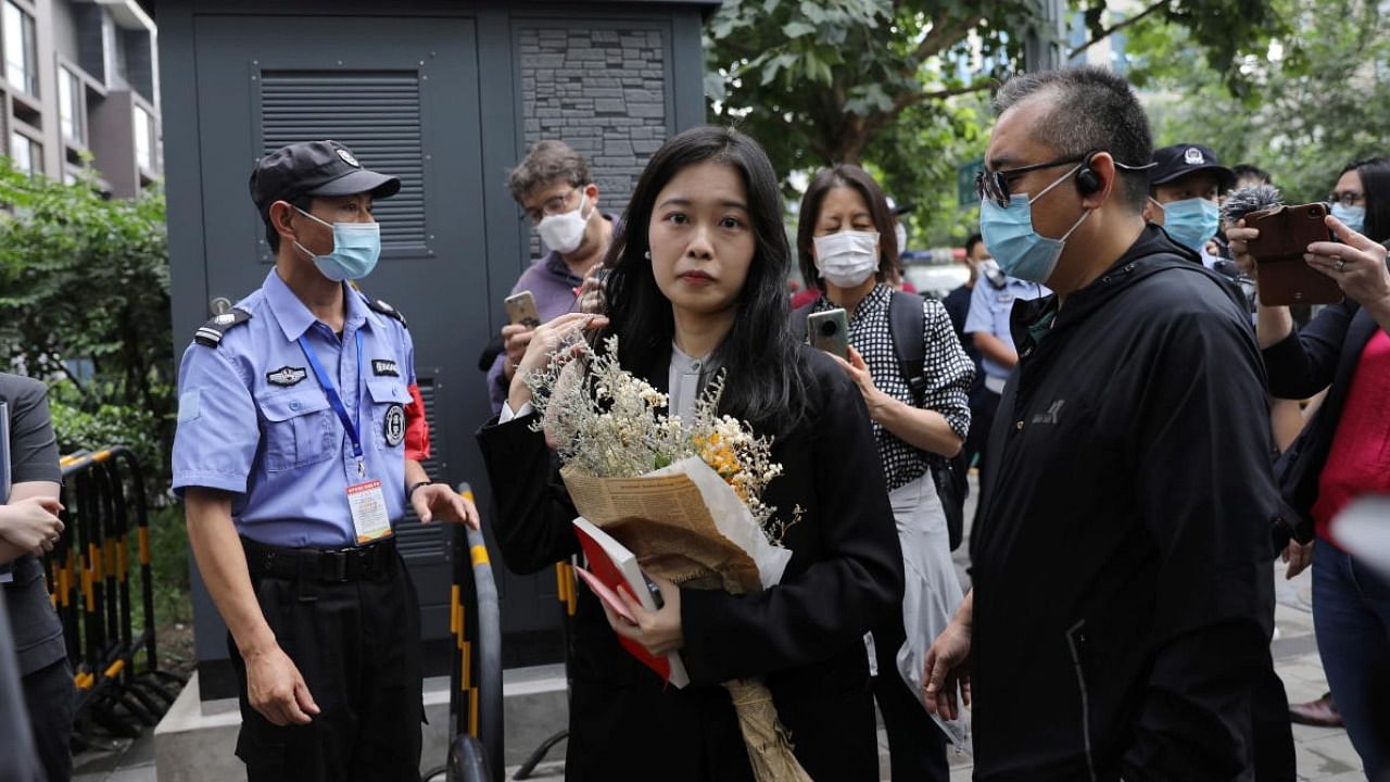 Zhou Xiaoxuan, also known by her online name Xianzi, arrives at a court for a sexual harassment case involving a Chinese state TV host, in Beijing, China. Credit: Reuters Photo