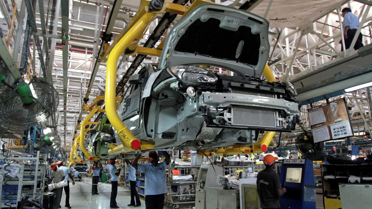 Workers assemble Ford cars at a plant of Ford India in Chengalpattu on the outskirts of Chennai. Credit: Reuters Photo