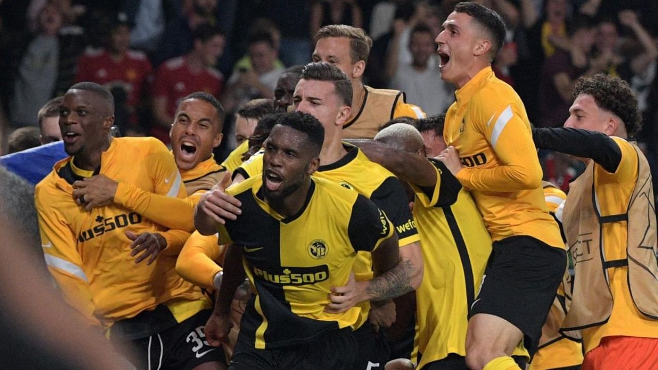 Young Boys' Cameroonian midfielder Nicolas Moumi Ngamaleu (C) celebrates after scoring a goal with teammates during the UEFA Champions League Group F football match between Young Boys and Manchester United at Wankdorf stadium in Bern. Credit: AFP Photo
