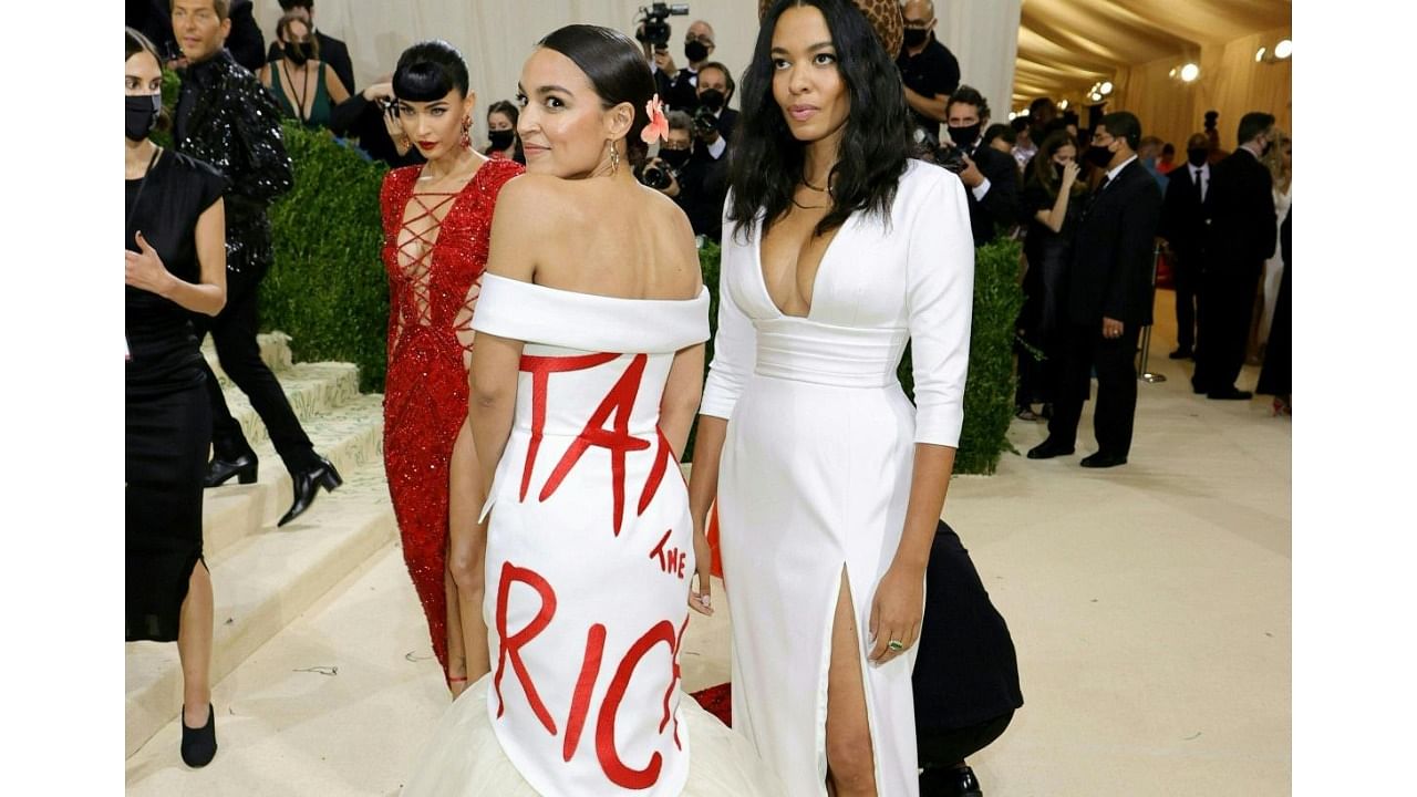  A proposal making its way through Congress and even adorning the dress of one of its most prominent lawmakers, "tax the rich" has become a rallying cry for Democrats as they seek to remake the United States' social safety net. Credit: AFP Photo