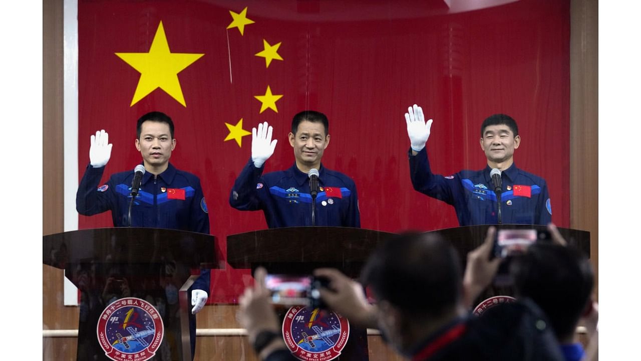  Chinese astronauts, from left, Tang Hongbo, Nie Haisheng, and Liu Boming. Credit: AP Photo