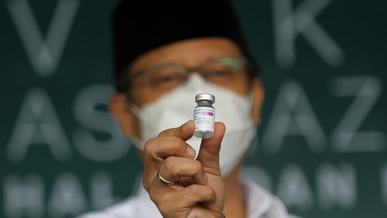 Indonesian Health Minister Budi Gunadi Sadikin shows the AstraZeneca coronavirus vaccine at a mass vaccination programme in Surabaya, Indonesia. Credit: Reuters File Photo