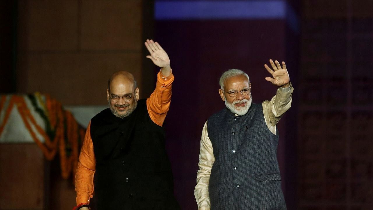 Amith Shah (L) and PM Modi. Credit: Reuters File Photo