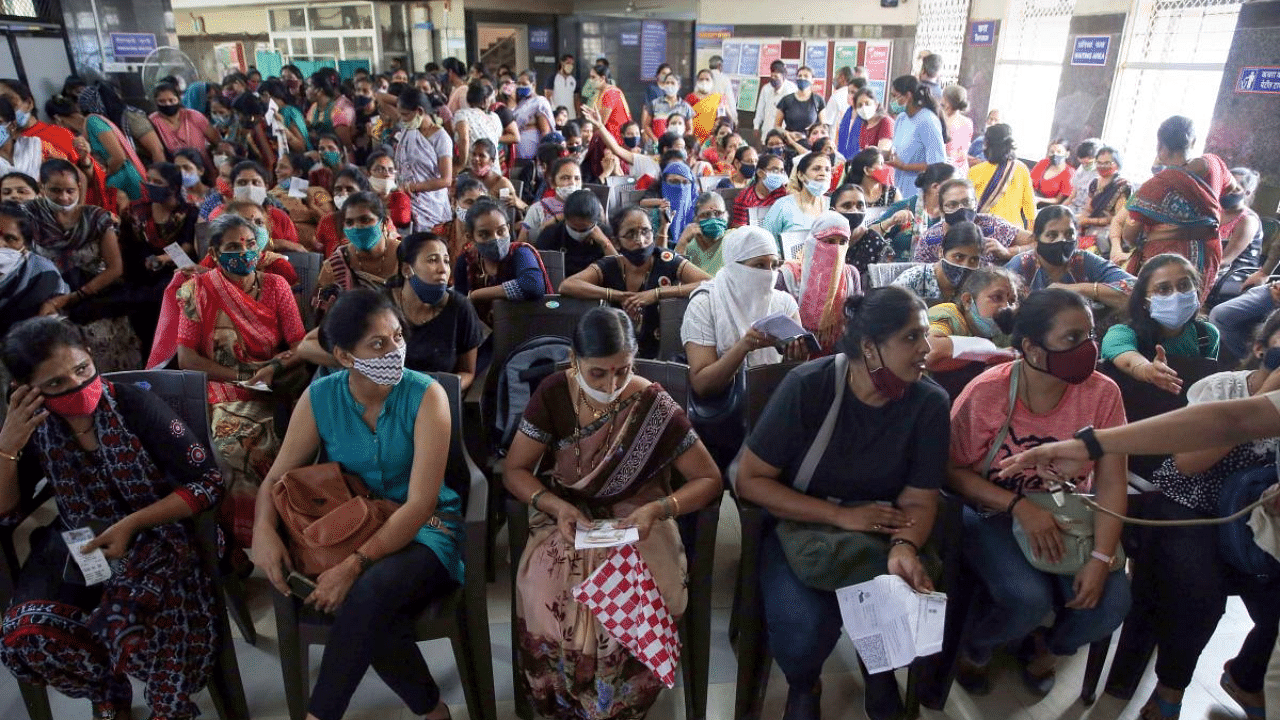 Women beneficiaries wait to receive vaccine shots during a special Covid-19 vaccination drive organised for women by the Brihanmumbai Municipal Corporation (BMC), in Mumbai. Credit: PTI Photo