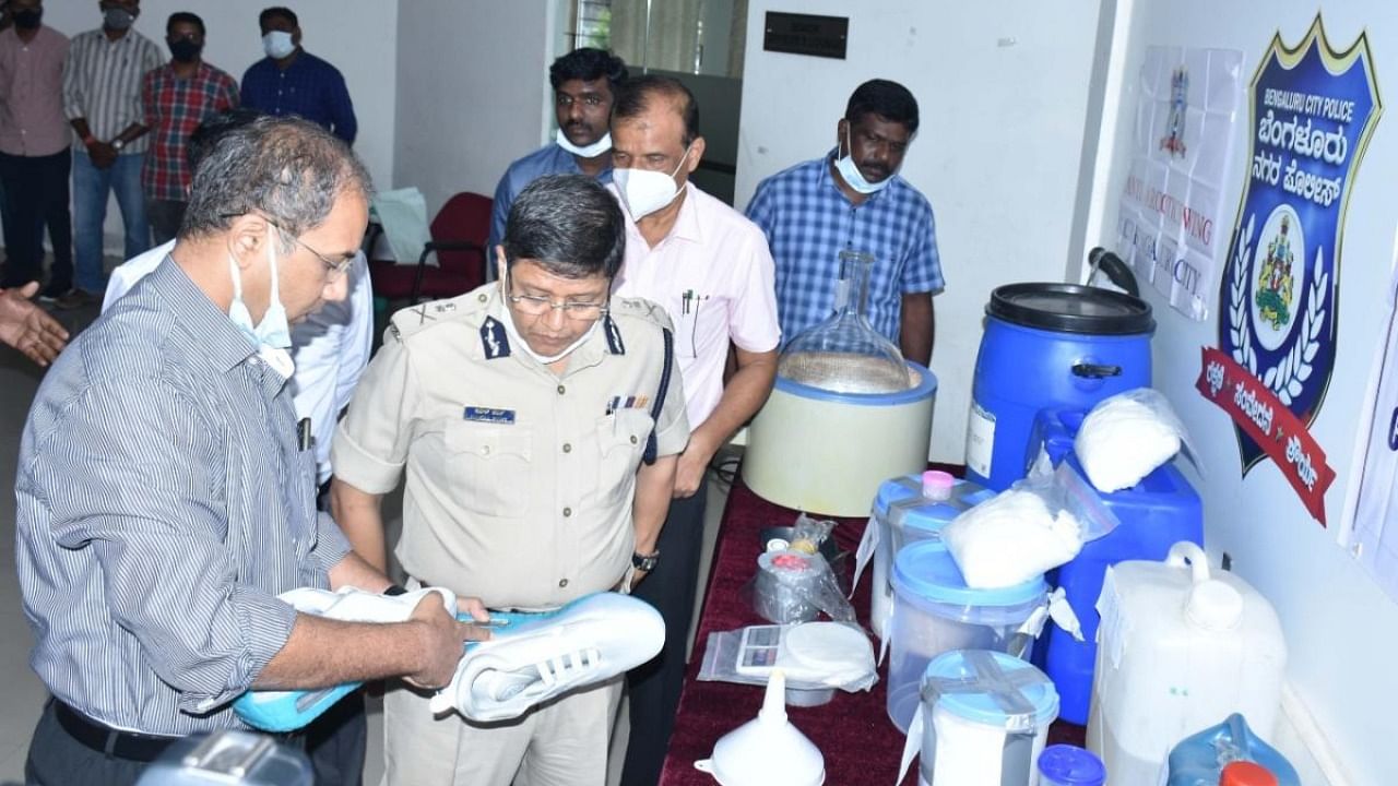 Joint Commissioner Sandeep Patil (Crime) explains how illicit drugs were manufactured to Bengaluru police chief Kamal Pant. 
