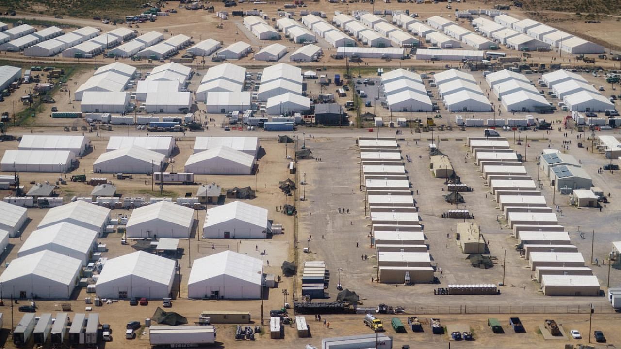  Tents are set up at Fort Bliss' DoÃ±a Ana Village, in New Mexico, where Afghan refugees are being housed. Credit: AP Photo
