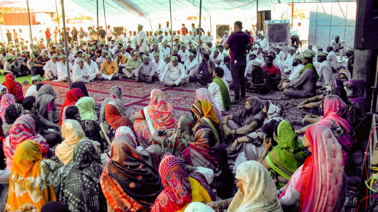  Farmers stage a protest over their demands, at Harola village in Noida. Credit: PTI Photo