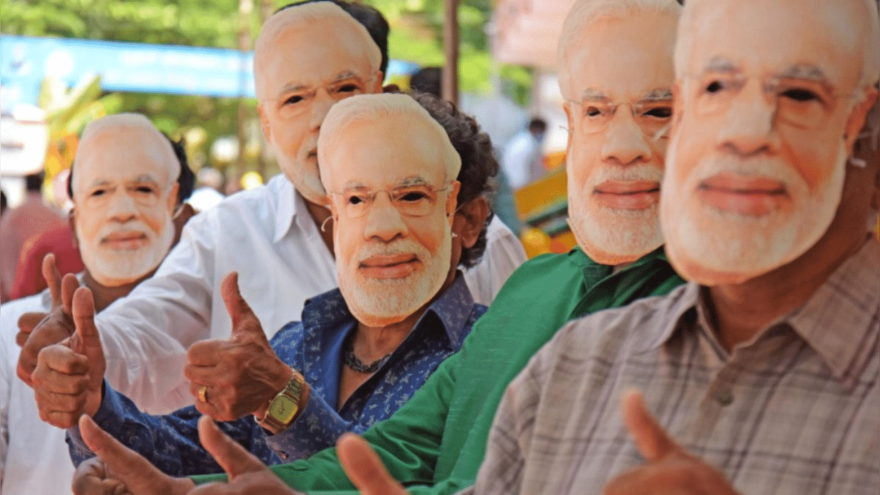 People wear Prime Minister Narendra Modi's masks on the occasion of his birthday in Mellaswaram, Bengaluru. Credit: DH Photo/Pushkar V