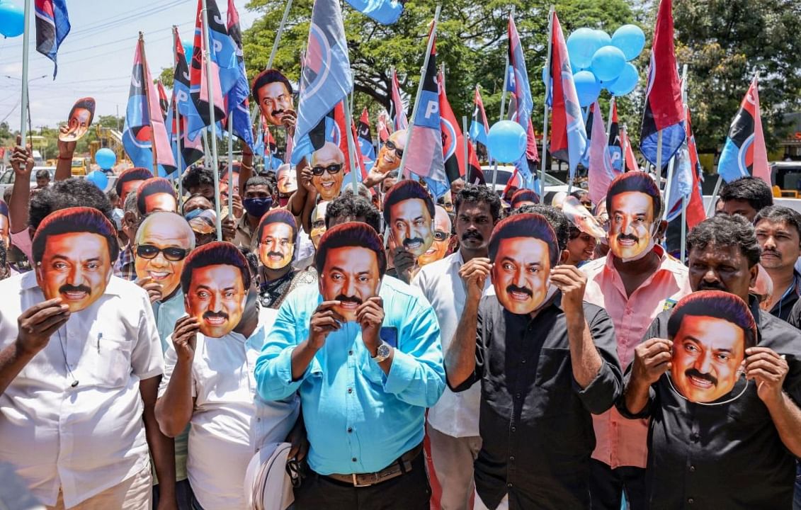Activists of Samuga Needhi Katchi wear masks of Tamil Nadu Chief Minister MK Stalin and former chief minister M Karunanidhi, during the pledge owing on the 143rd birth anniversary of Thanthai Periyar, in Coimbatore. Credit: PTI Photo