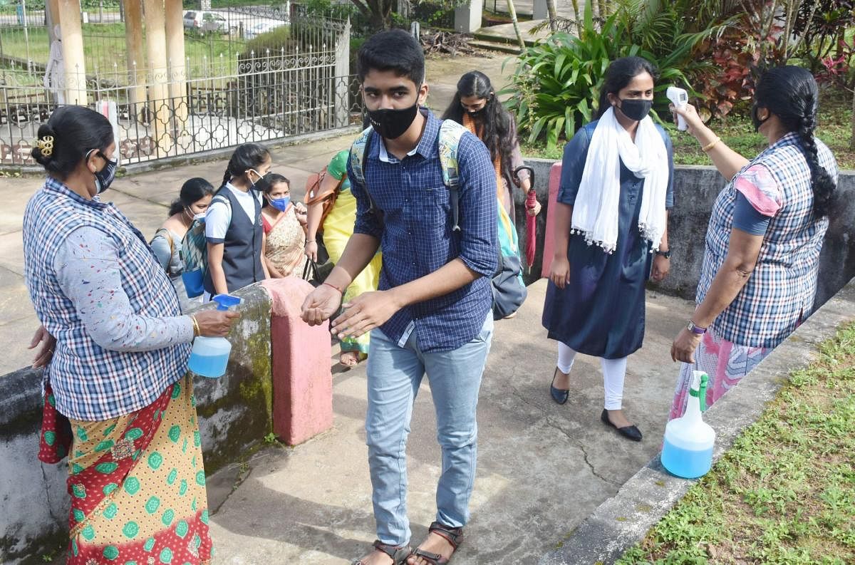 Students arrive at a school in Kodagu district.