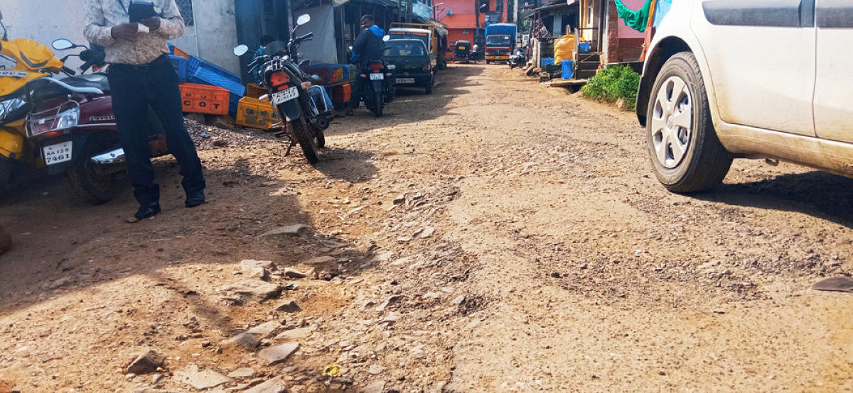 The poor condition of the road leading to the market in Madapura.