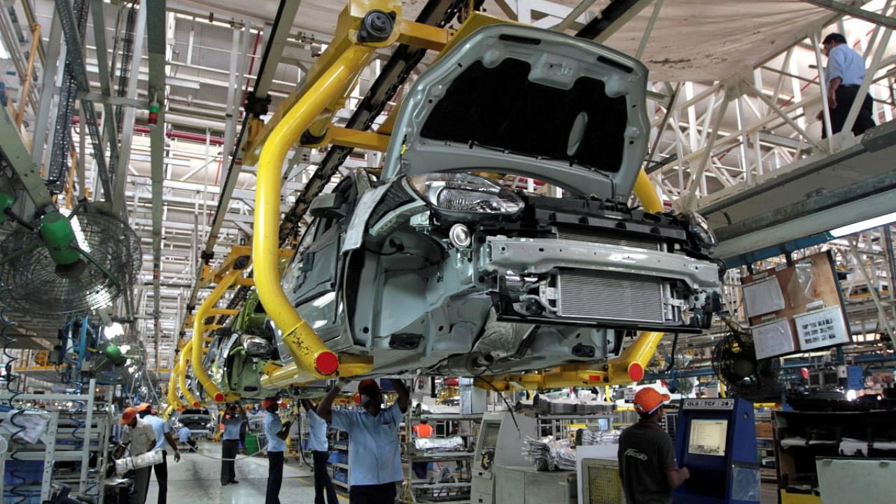Workers assemble Ford cars at a plant of Ford India in Chengalpattu on the outskirts of Chennai, India. Credit: Reuters Photo
