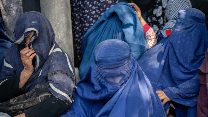 He says that before the Taliban takeover of Afghanistan last month, just under one-third of close to 3,000 city employees were women who worked in all departments. Credit: AFP Photo
