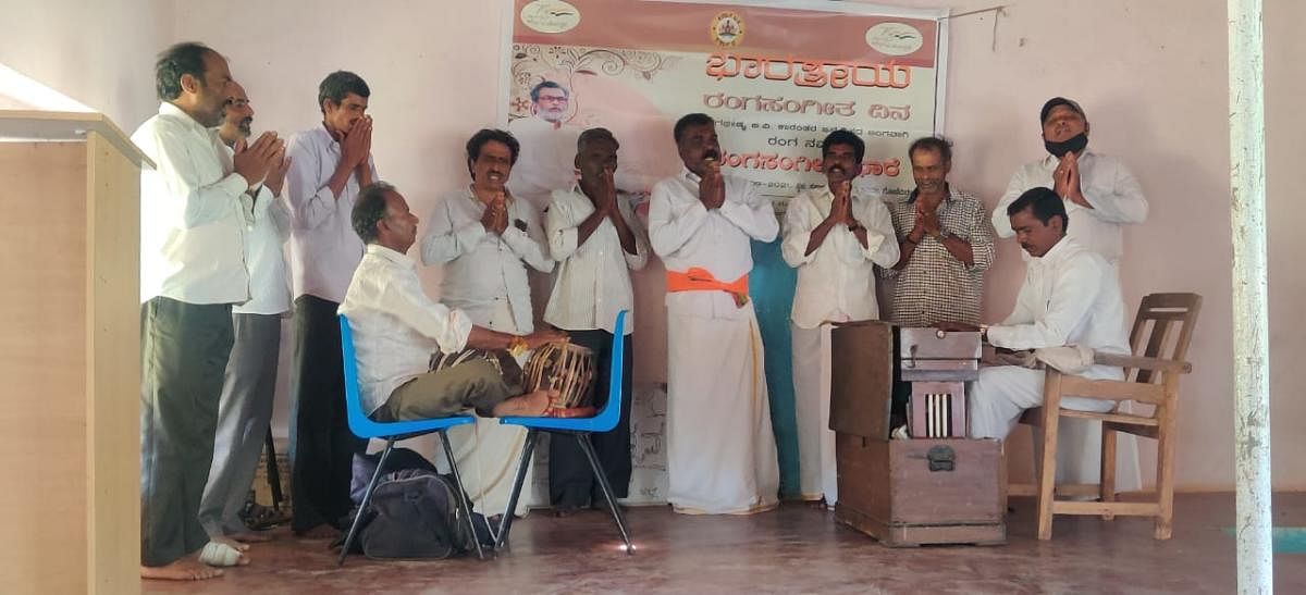 Theatre artistes sing songs on the occasion of the birth anniversary of B V Karanth during a programme held in Gonimaruru.