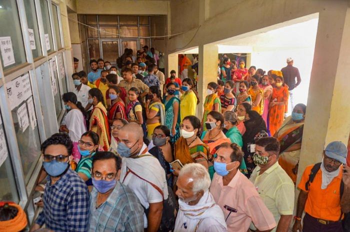 Beneficiaries wait in queues to receive Covid-19 vaccine dose at the District Hospital in Mirzapur. Credit: PTI Photo