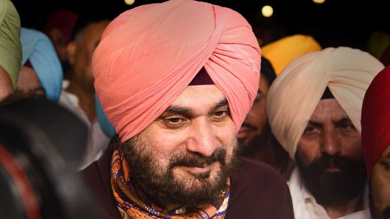Punjab Congress President Navjot Singh Sidhu after Punjab CM Designate Charanjit Singh Channi was announced as the next CM of Punjab, outside Governor's residence in Chandigarh. Credit: PTI Photo