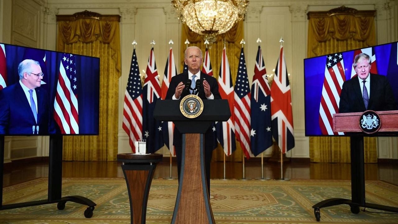 US President Joe Biden participates is a virtual press conference on national security with British Prime Minister Boris Johnson (R) and Australian Prime Minister Scott Morrison in the East Room of the White House in Washington. Credit: AFP Photo