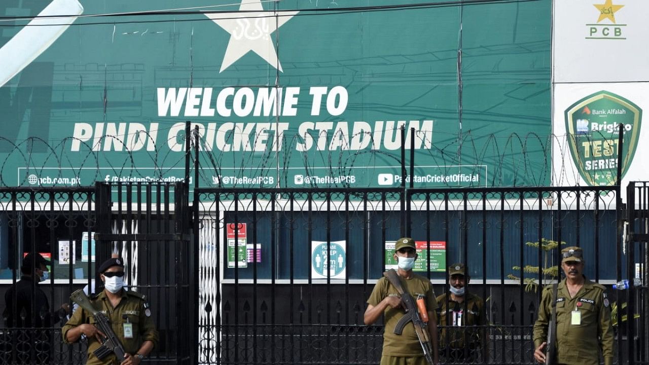 Police officers stand guard outside Rawalpindi Cricket Stadium after New Zealand cricket team pull out of a Pakistan cricket tour over security concerns. Credit: Reuters Photo
