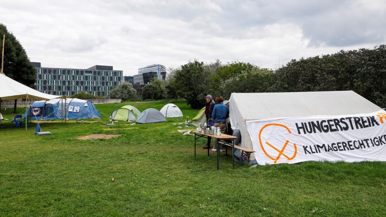 Climate activists take part in the 22nd day of hunger strike in their camp in Berlin, Germany. Credit: Reuters file photo