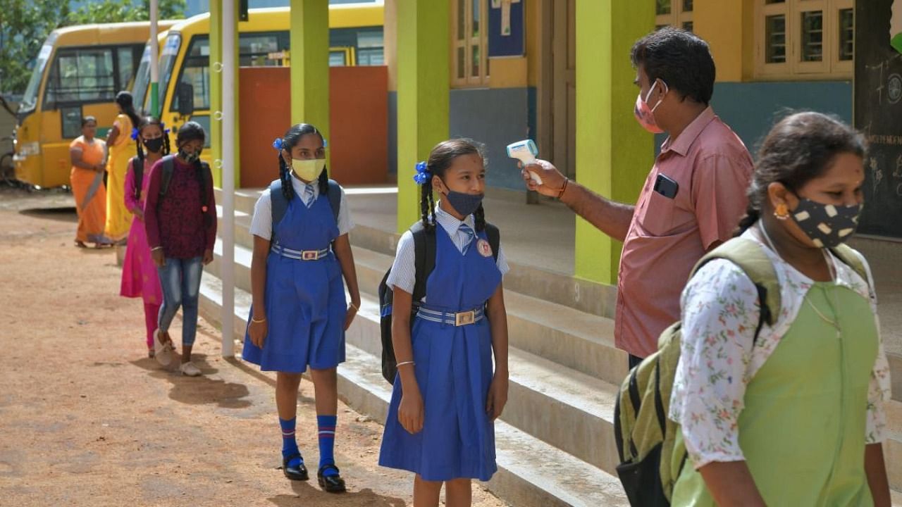 Daily RT-PCR testing was done for children after the schools reopened in Karnataka. Credit: AFP File Photo