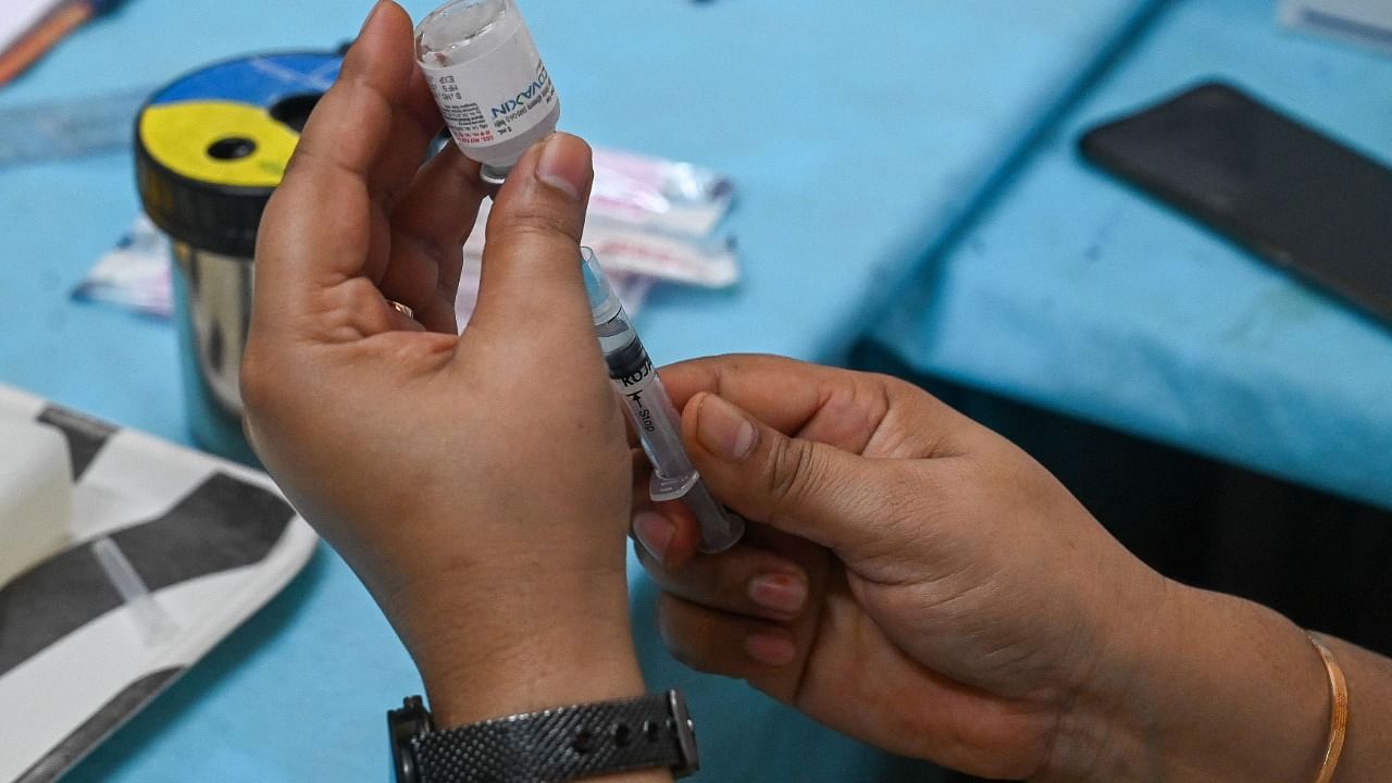 A health worker prepares a dose of Covaxin vaccine against Covid-19. Credit: AFP File Photo