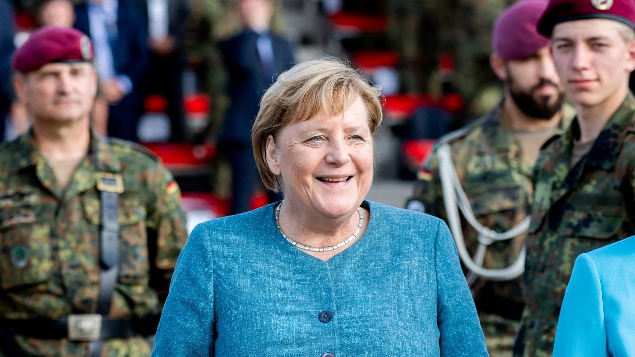 German Chancellor Angela Merkel attends a recruits pledge during a military roll call of the military evacuation operation (MilEvakOp), in Seedorf, northern Germany on September 22, 2021. Credit: AFP Photo